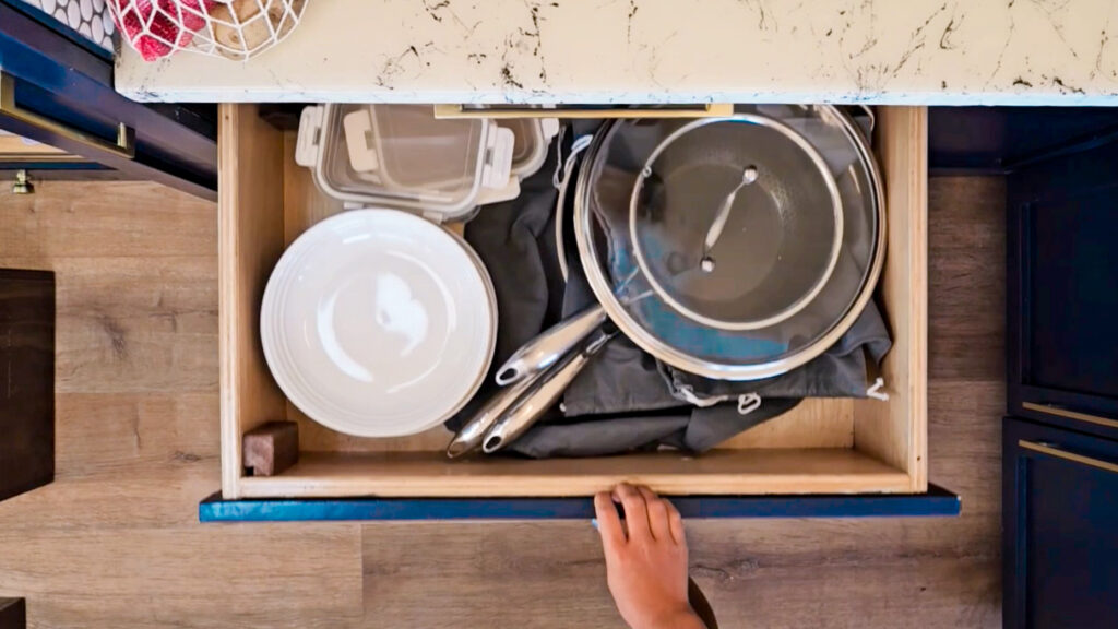 space-saving nesting cookware in a skoolie kitchen